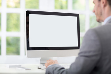 businessman front of desktop