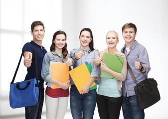 Wall Mural - group of smiling students showing thumbs up