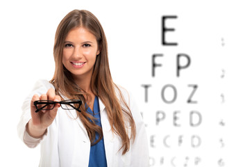 Oculist holding a pair of eyeglasses