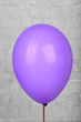 © Africa Studio - Color balloon on grey wall background