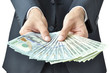 © Atstock Productions - Hands holding money - United States dollar (USD) bills