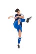 © WavebreakMediaMicro - Football player in blue jersey kicking