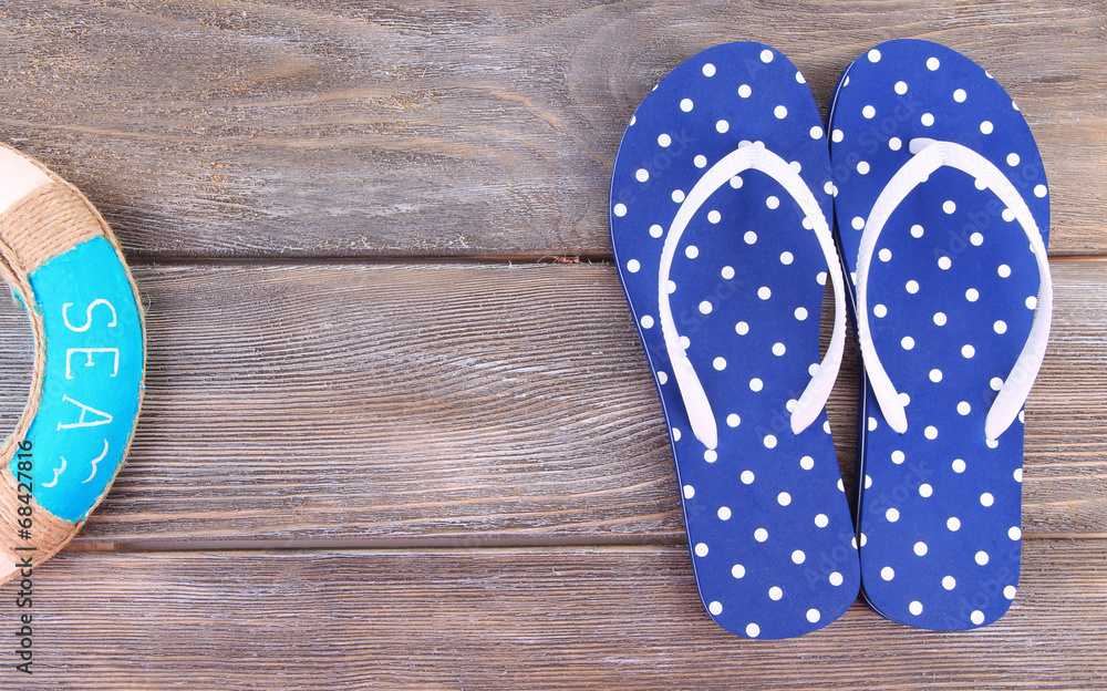 Color flip-flops on wooden background