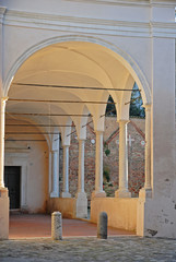 Wall Mural - Ravenna, old Saint Spirit Basilica portico at sunset.