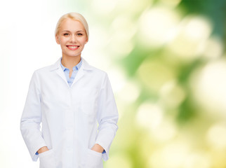 Sticker - smiling female doctor over natural background