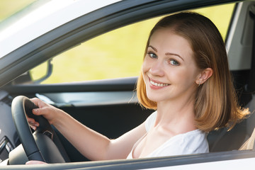 Wall Mural - female driver driving a car