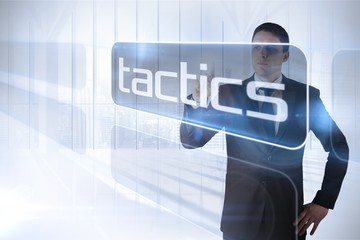 Aufkleber - Businessman presenting the word tactics