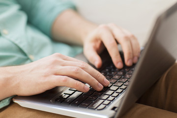 Poster - close up of man working with laptop at home