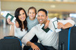 © michaeljung - family holding boarding pass and passport
