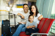 © michaeljung - family at airport waiting for flight