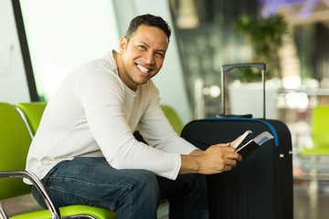 Wall Mural - man holding smart phone at airport