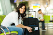 © michaeljung - woman waiting for flight at airport