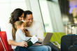 © michaeljung - family using laptop computer at airport