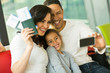 © michaeljung - family taking selfie with smart phone at airport