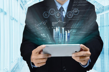 Wall Mural - businessman using tablet to view report