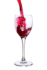 Red wine pouring into wine glass