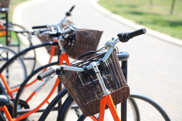 road bike with a wicker basket of orange on the steering wheel