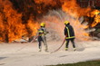 fire crew fighting aircraft fire