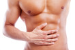© cristovao31 - Muscular man having stomach pain, isolated on white background