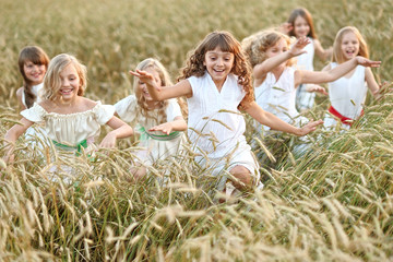 Sticker - portrait of little girls running on the field