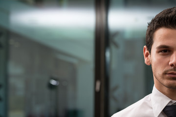 Portrait Half Of Face Of Young Businessman