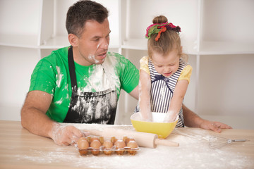 Father and daughter cooking