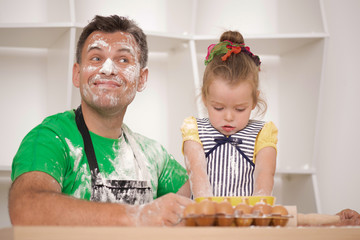 Father and daughter cooking