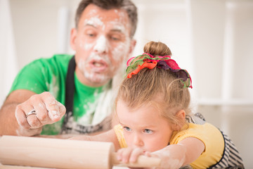 Wall Mural - Father and daughter cooking