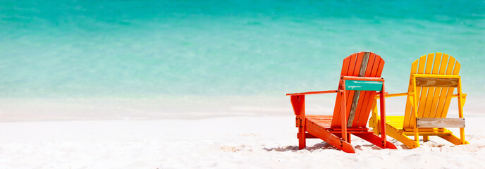 Wall Mural - Colorful chairs on Caribbean beach