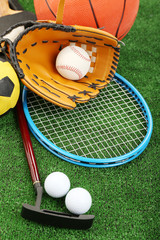 Sticker - Sports equipment on grass background