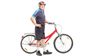 Poster - Active senior pushing a bicycle and posing