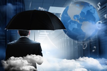 Aufkleber - Composite image of mature businessman holding an umbrella
