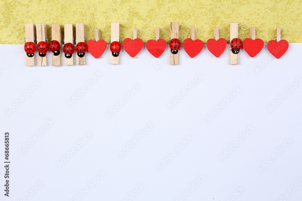 Abstract background with colorful wooden pins and paper