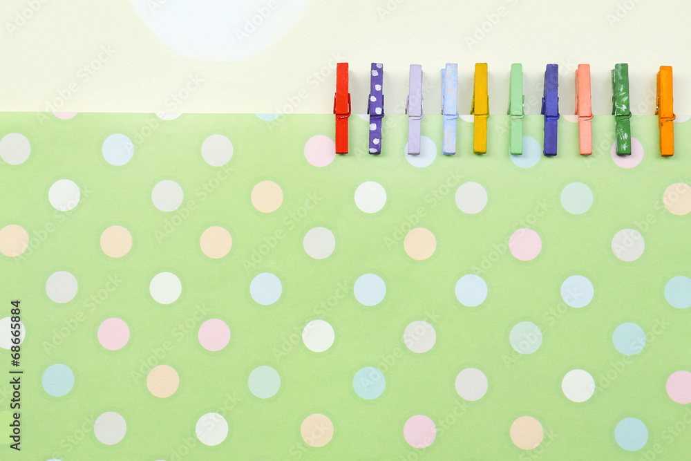 Abstract background with colorful wooden pins and paper