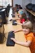 © WavebreakmediaMicro - Cute pupils in computer class