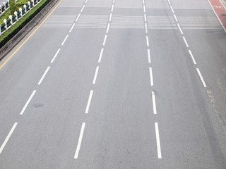 Asphalt road with white stripes