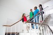 © WavebreakmediaMicro - Cute pupils smiling and walking down stairs