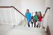 © WavebreakmediaMicro - Cute pupils smiling and walking up stairs