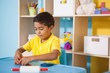 © WavebreakMediaMicro - Cute little boys playing with modelling clay in classroom