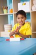© WavebreakMediaMicro - Cute little boy playing with modelling clay in classroom