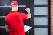 © Photographee.eu - Delivery man knocking on the client's door