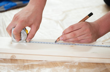 Wall Mural - Man's hands during renovation