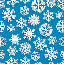 Seamless Pattern Of Paper Snowflakes On Blue