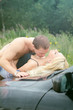 © M-Production - Sensual couple making love on the car's hood.