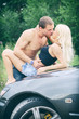 © M-Production - Sensual couple making love on the car's hood.