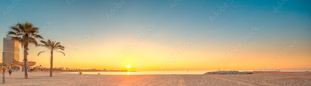 Obraz na płótnie Barceloneta Beach in Barcelona at sunrise w salonie
