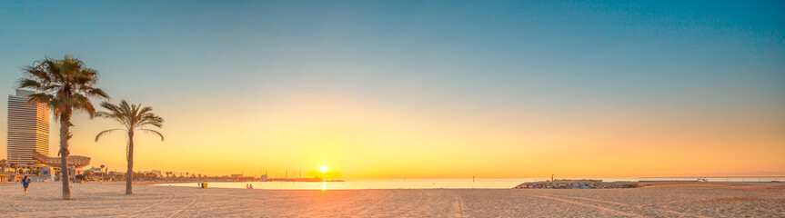 Wall Mural - barceloneta beach in barcelona at sunrise