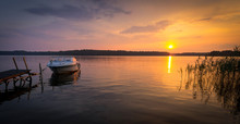 Idyllic Panorama Landscape Of Swedish Lake Sunset