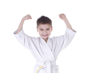 Young boy fighter in kimono with hand up isolated on white backg