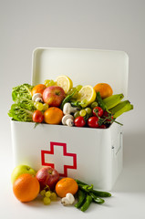 Wall Mural - Healthy food. First aid box filled with fruits and vegetables.